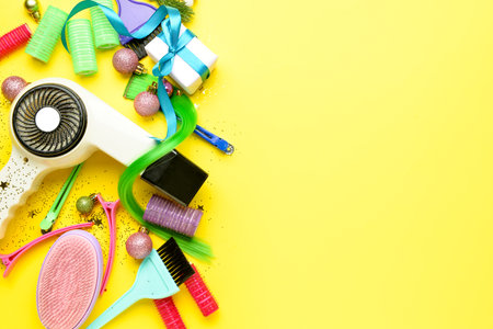 Hairdresser's tools and Christmas decor on color backgroundの写真素材