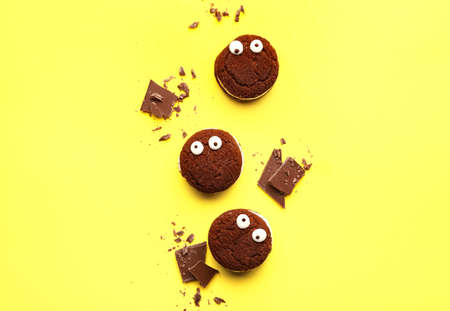 Funny chocolate cookies on color backgroundの写真素材