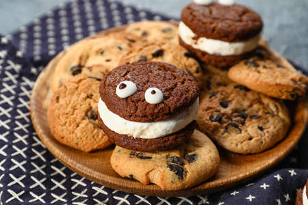 Plate with tasty cookies for Halloween on dark backgroundの写真素材