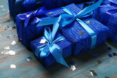 Christmas gifts on blue wooden backgroundの写真素材