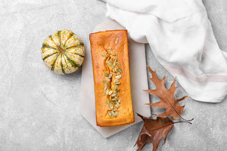 Tasty pumpkin pie on light background