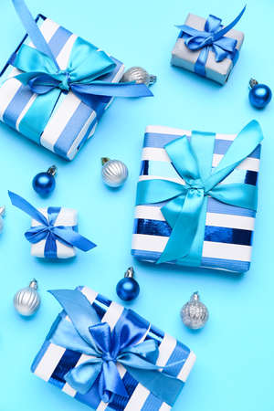 Beautiful Christmas gifts with decor on blue backgroundの写真素材