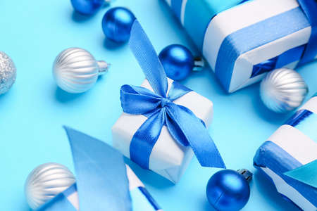 Beautiful Christmas gifts with decor on blue backgroundの写真素材