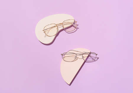 Stylish eyeglasses on purple backgroundの写真素材