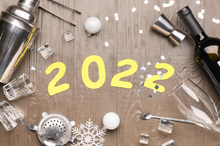 Figure 2022 with supplies of bartender on wooden backgroundの写真素材