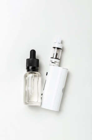 Modern vape mod and oil on white backgroundの写真素材