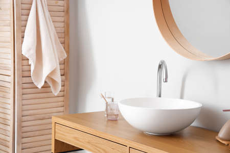 Sink in interior of light bathroomの写真素材