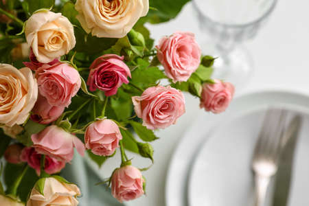 Beautiful roses on served table, closeupの写真素材