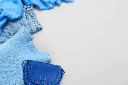 Stylish female clothes and handbag on light background, closeupの写真素材