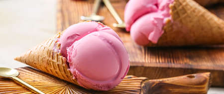 Tasty strawberry ice cream on table, closeup