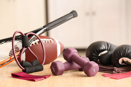 Stylish sport equipment on floor in roomの写真素材
