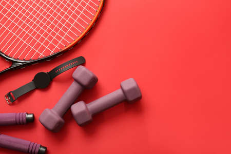 Stylish sport equipment on red backgroundの写真素材