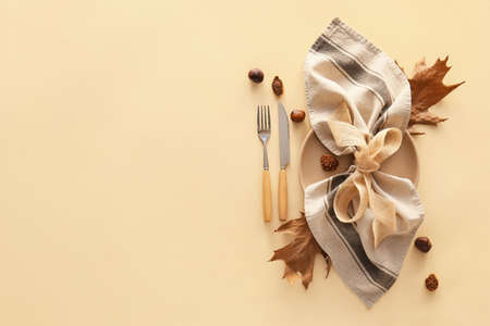 Autumn table setting on beige background