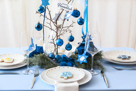 Beautiful table setting for Hanukkah celebration in dining room
