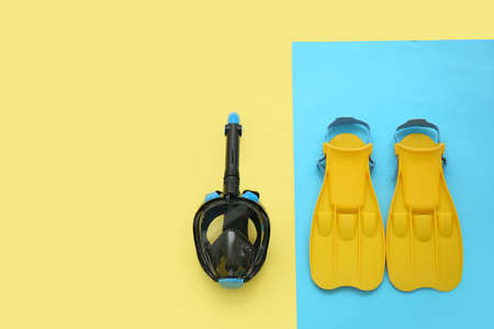 Paddles with snorkeling mask on color backgroundの写真素材