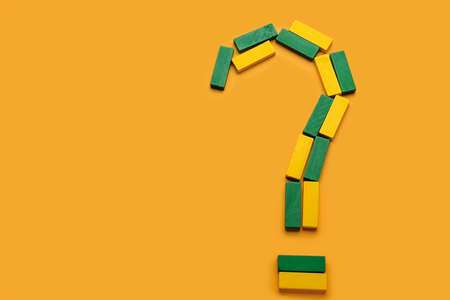 Question mark made of colorful blocks on color background