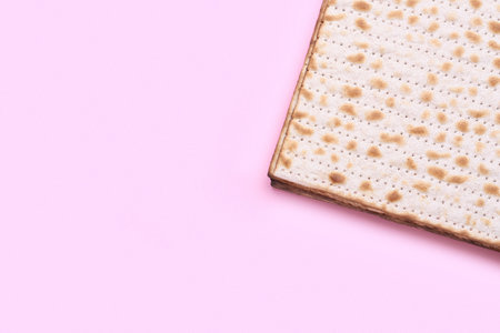 Jewish flatbread matza for Passover on pink background, closeupの写真素材