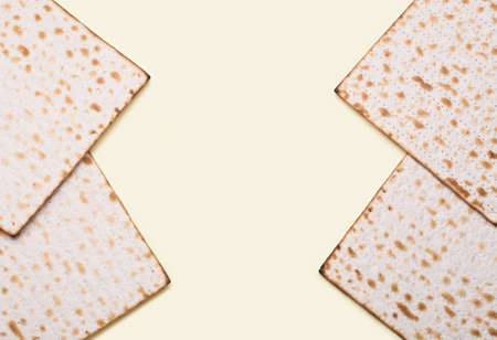 Frame made of Jewish flatbread matza for Passover on yellow backgroundの写真素材