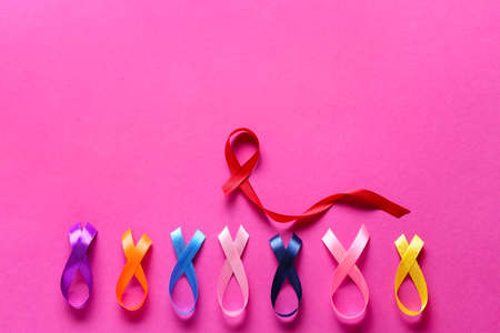 Colorful awareness ribbons on pink background. World Cancer Dayの写真素材