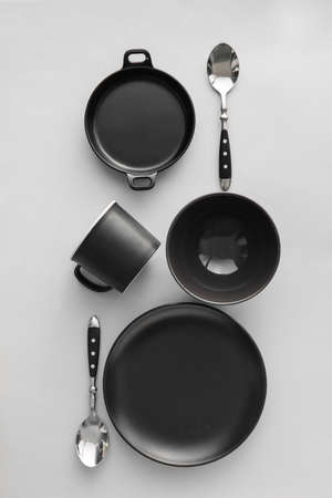Set of beautiful dinnerware on light background