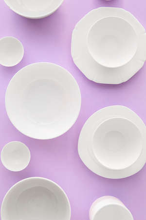 Set of stylish dinnerware on purple backgroundの写真素材