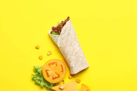 Tasty burrito on yellow backgroundの写真素材