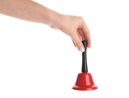 Female hand with red Christmas bell on white background, closeupの写真素材