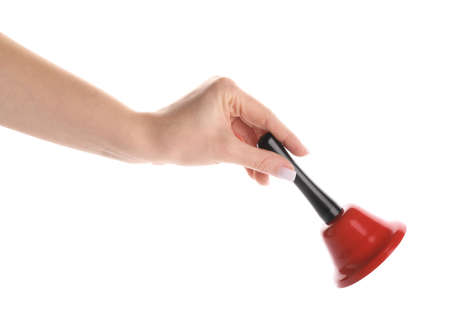 Female hand with red Christmas bell isolated on white background, closeupの写真素材