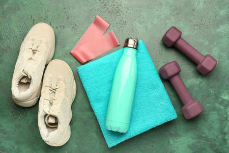 Stylish sport equipment on green backgroundの写真素材