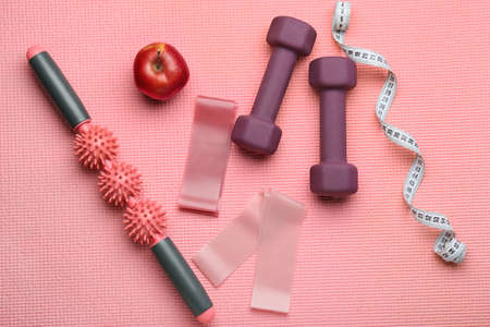 Stylish sport equipment on fitness matの写真素材