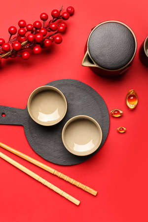 Tasty Chinese tea on red backgroundの写真素材
