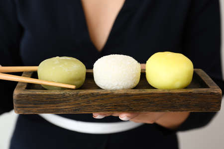 Asian woman with tasty Japanese mochi, closeupの写真素材