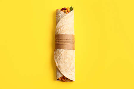 Delicious burrito on yellow backgroundの写真素材