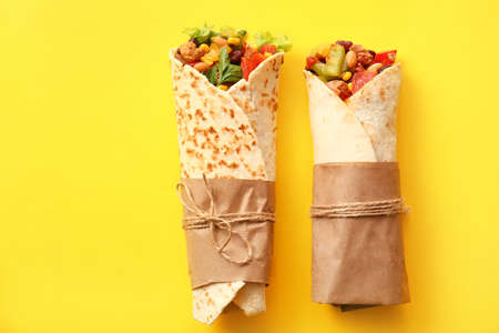 Delicious burritos on yellow backgroundの写真素材