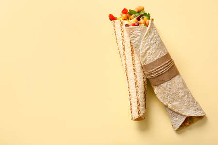 Delicious burritos on beige backgroundの写真素材