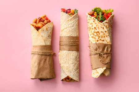 Delicious burritos on pink backgroundの写真素材
