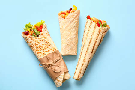 Delicious burritos on blue backgroundの写真素材
