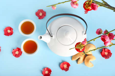 Traditional Chinese tea with cookies on color backgroundの写真素材