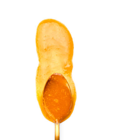 Spoon of tasty tangerine jam on white backgroundの写真素材