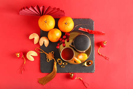 Traditional tea with Chinese symbols on color backgroundの写真素材