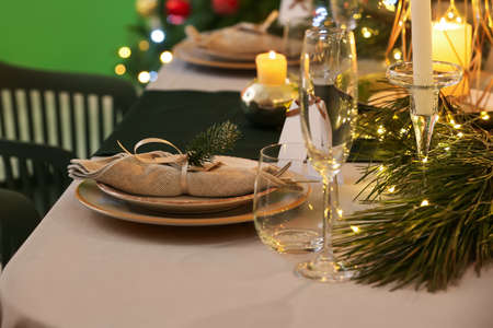 Dining table with setting for Christmas celebration indoorsの写真素材