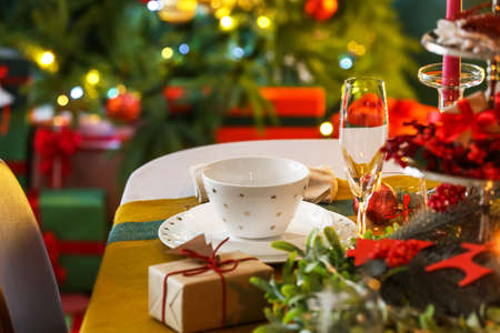 Dining table with setting for Christmas celebration indoorsの写真素材