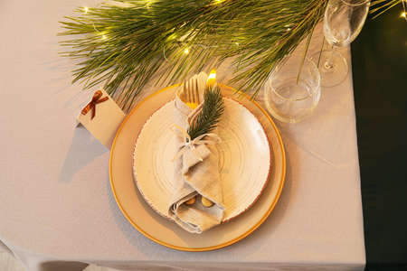Dining table with setting for Christmas celebration, top view