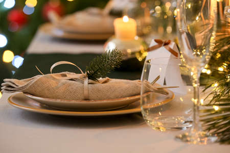 Dining table with setting for Christmas celebration indoorsの写真素材