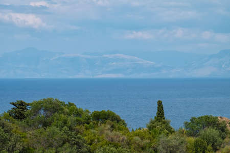 Beautiful view of sea coast with green forestの写真素材