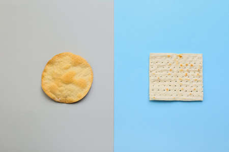 Different Jewish flatbread matza for Passover on color backgroundの写真素材