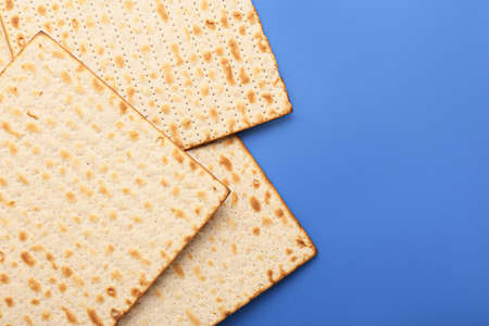 Jewish flatbread matza for Passover on blue backgroundの写真素材