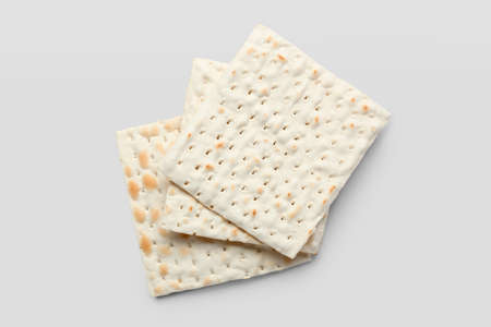 Jewish flatbread matza for Passover on white background, top view