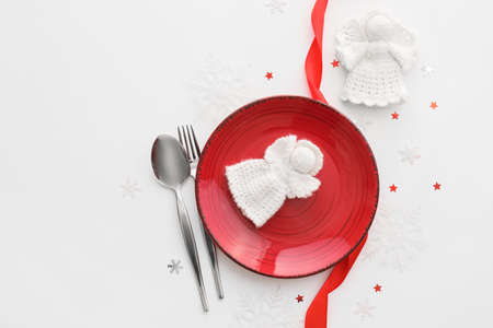 Beautiful Christmas table setting with decor on white backgroundの写真素材