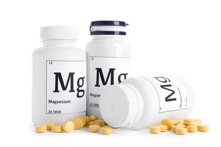 Bottles with magnesium pills on white backgroundの写真素材